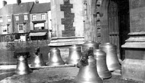 The bells of the Church of St. John the Evangelist, Scunthorpe, waiting to be hung inside the church in October 1893. 	
