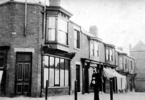 Belgrave Square, Scunthorpe, looking north. The gentleman in the photograph is wearing Great Central Railway uniform. 	