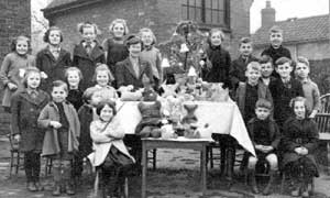 Miss Bird and pupils with toys they had made at Horkstow School, Horkstow, c.1942	