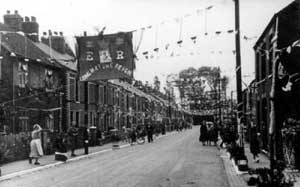 Victoria Road looking south, decorated for the Coronation of Elizabeth II, Ashby, on 2 June 1953.