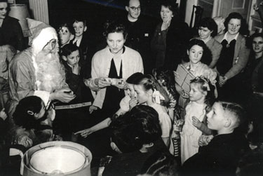 Children's Christmas party at Normanby Hall in front of the main staircase in the 1950's. 	